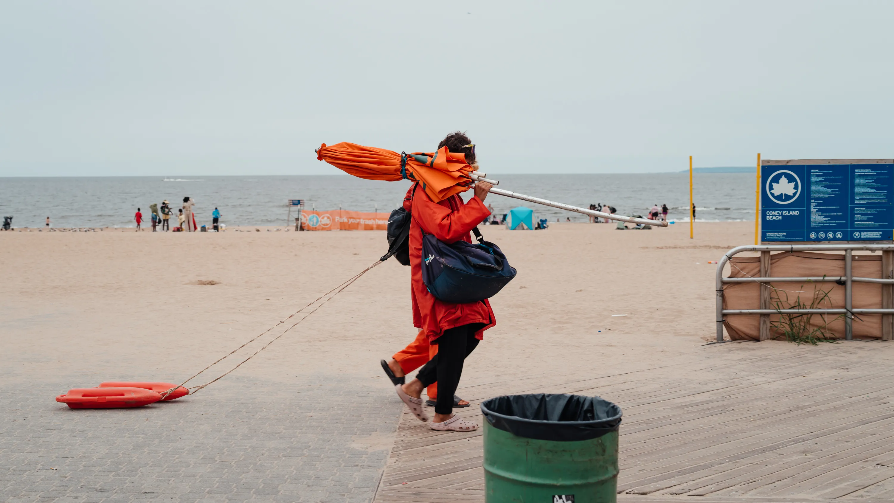 Lifeguards at the beach walk with their gear